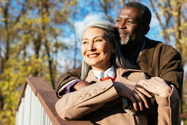Senior couple looking forward to the future with their newly purchased life insurance plan