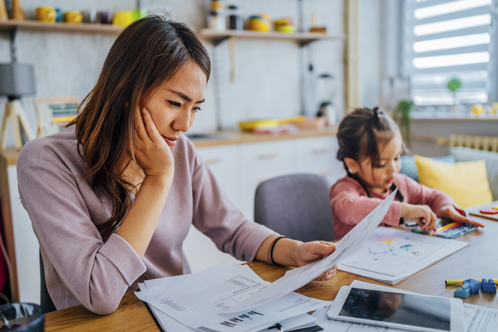 Canadian examining paperwork for traditional health insurance policy