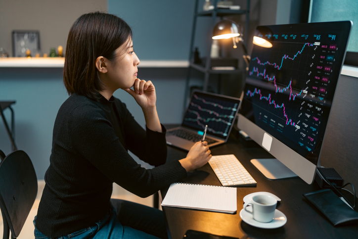 young woman investing in stock market